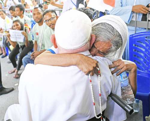 A nun embraces Pope Francis during a meeting with bishops, priests, deacons, religious, seminarians and pastoral workers at Immaculate Conception Cathedral in Dili, Timor-Leste, Sept. 10, 2024. (CNS photo/Vatican Media)